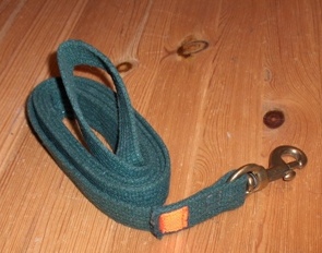Strap or sling with a loop and brass snap hook